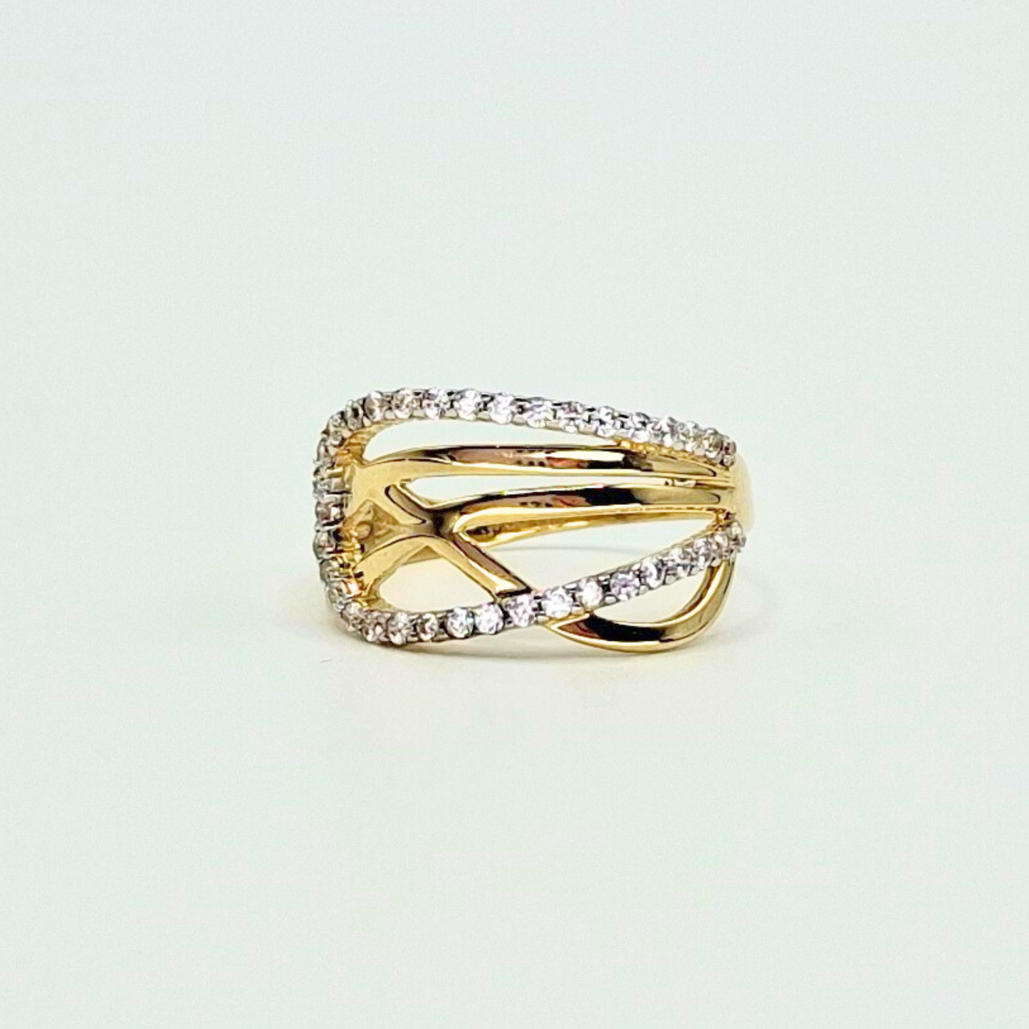 Anillo entrelazado infinito con circones, oro 18k
