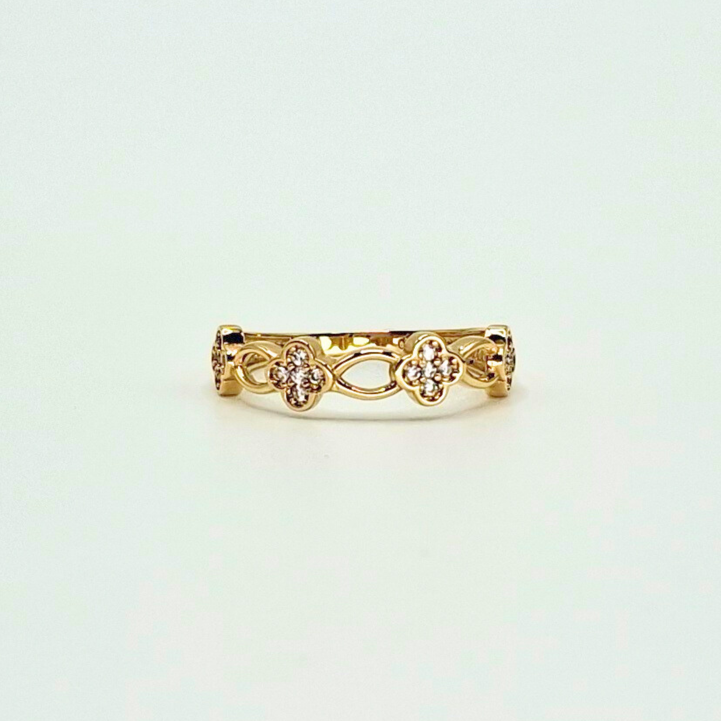 Anillo flores de circones, oro 18k
