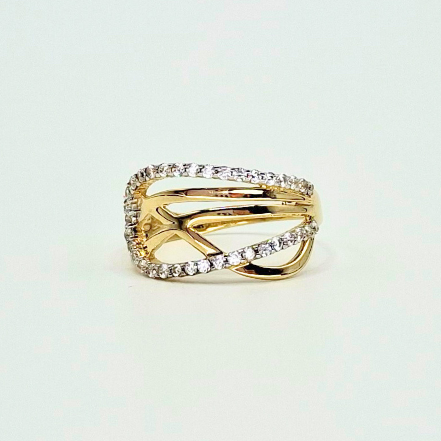 Anillo entrelazado infinito con circones, oro 18k