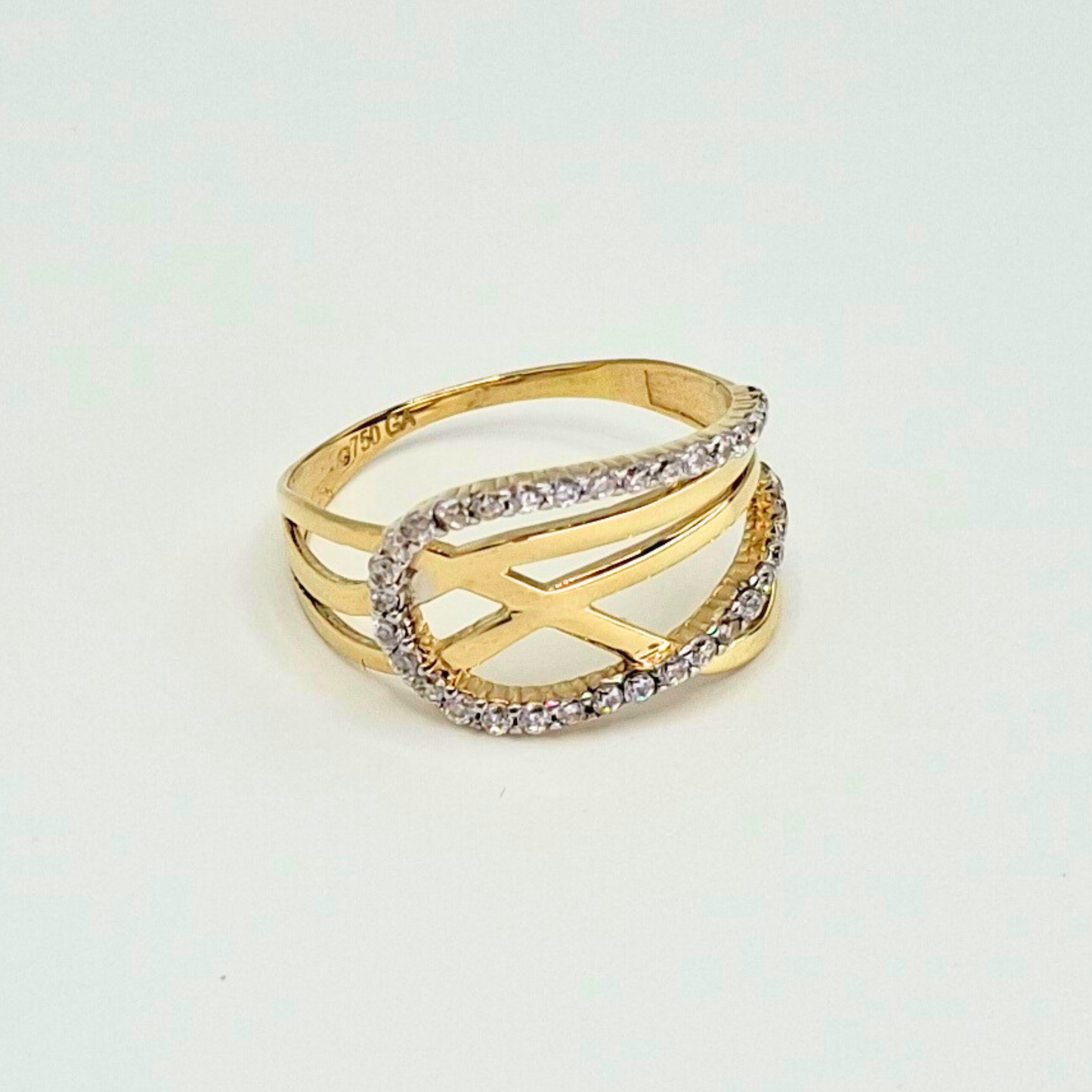 Anillo entrelazado infinito con circones, oro 18k