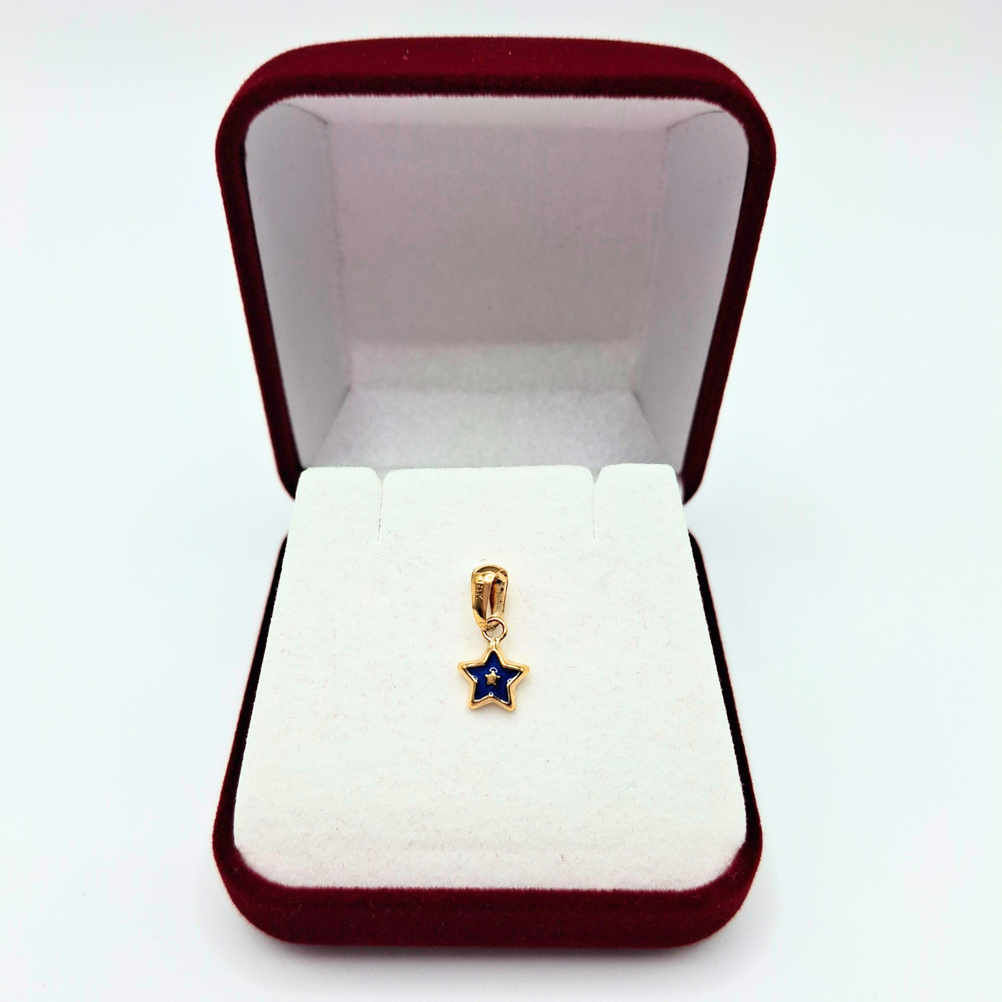Colgante estrella pequeña azul de oro 18k