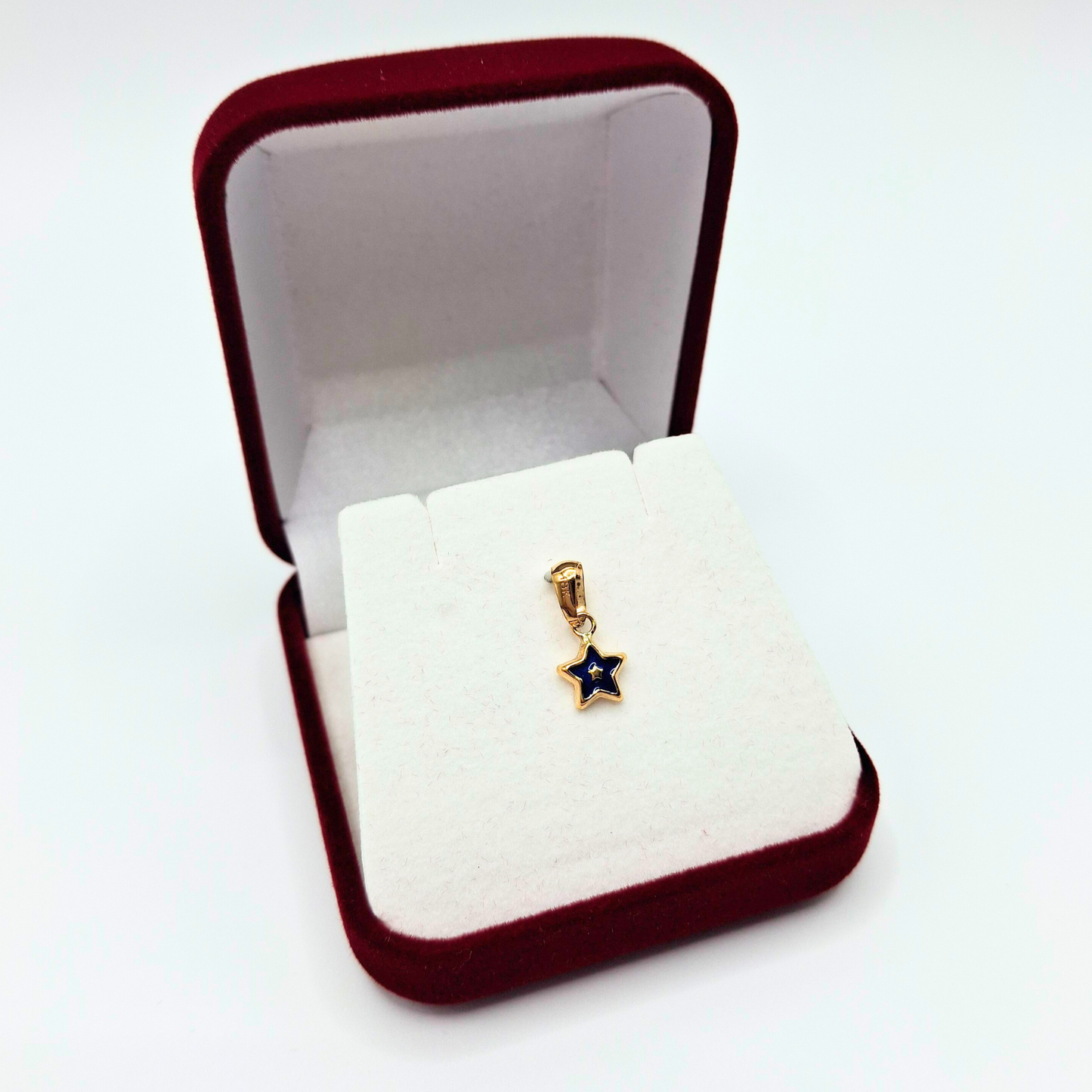 Colgante estrella pequeña azul de oro 18k