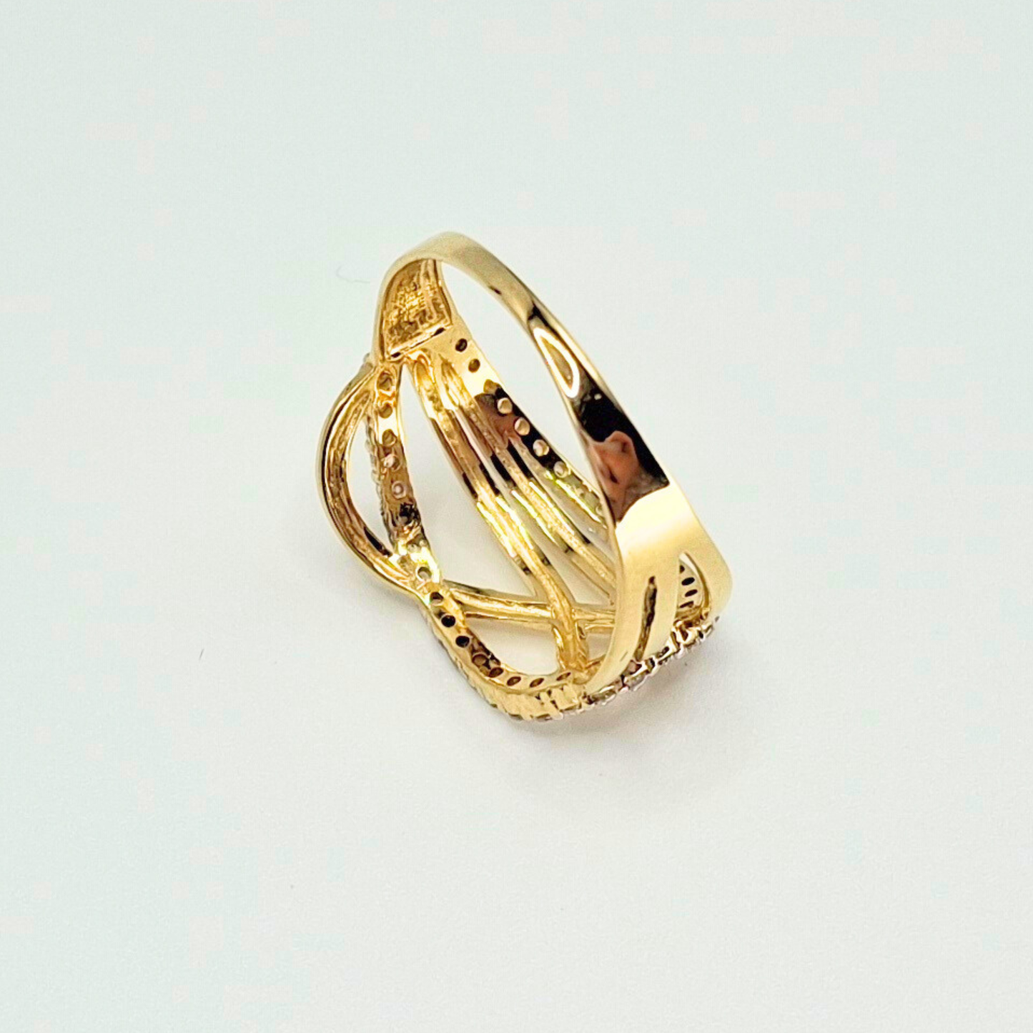 Anillo entrelazado infinito con circones, oro 18k