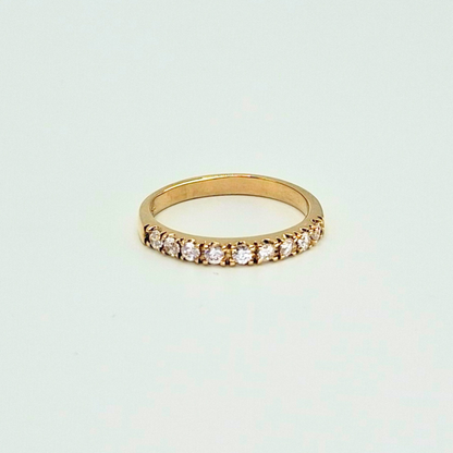 Anillo medio cintillo con circones, oro 18k