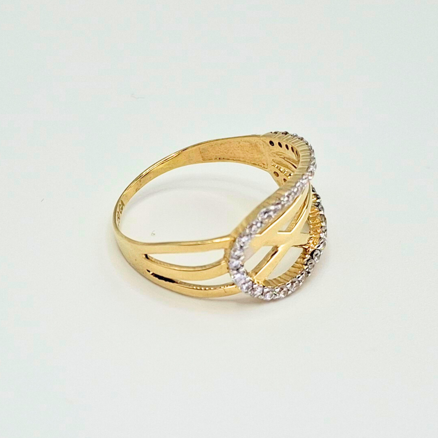 Anillo entrelazado infinito con circones, oro 18k